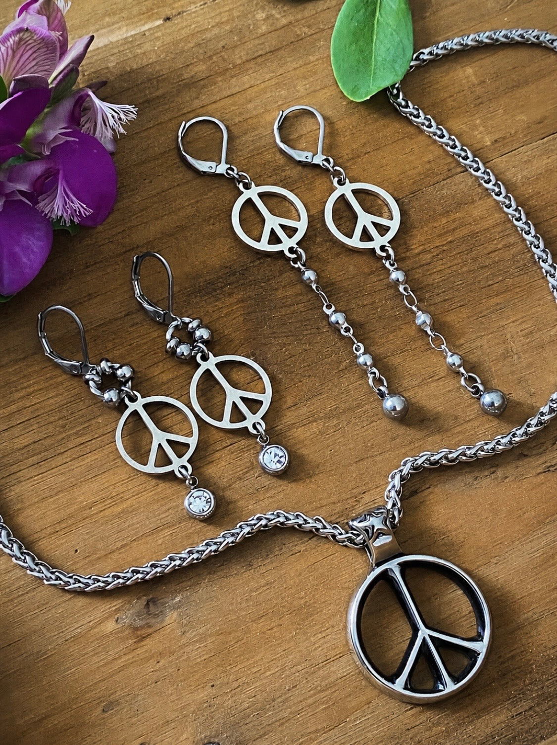 Additional product photo of the Peace Sign Drop Earrings showing the peace sign charm and beaded chain drop