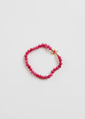 Pink beaded bracelet with 14k gold-filled accents and a toggle closure.