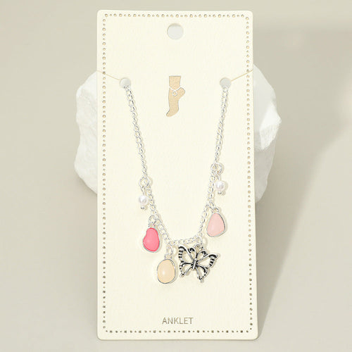 Silver-tone butterfly charm anklet with pink teardrop accents and pale round beads.