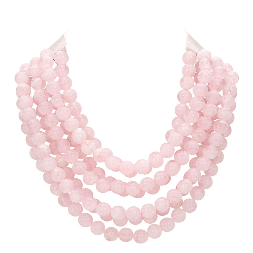 Chunky multi-strand beaded statement necklace shown in an additional colorway on a display form