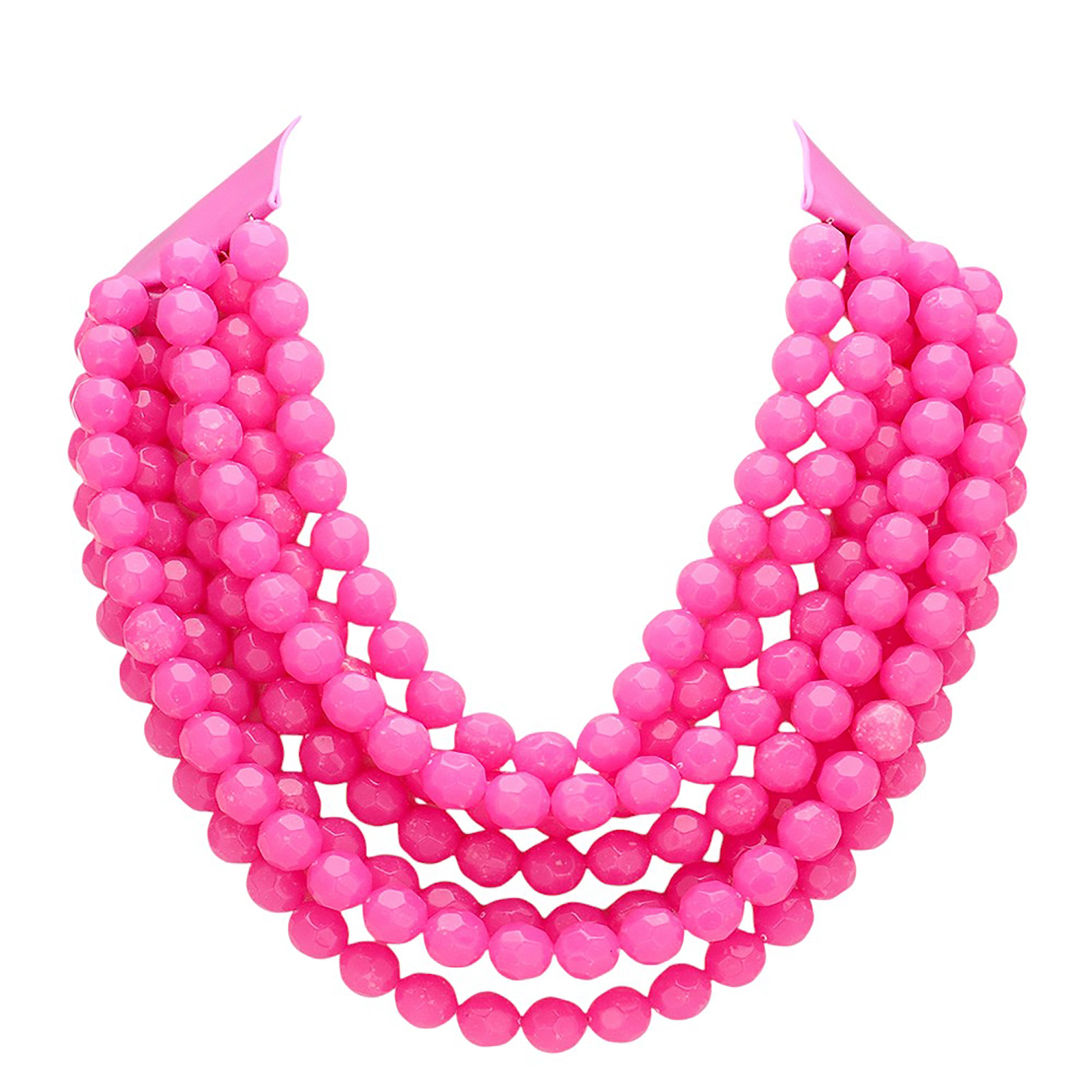 Hot pink multi-strand beaded statement necklace on a display form, all strands in solid bright pink