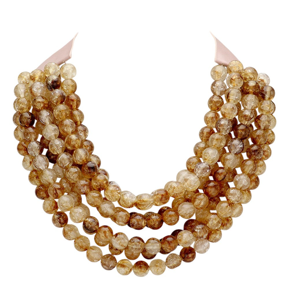 Chunky multi-strand beaded statement necklace shown in an additional colorway on a display form