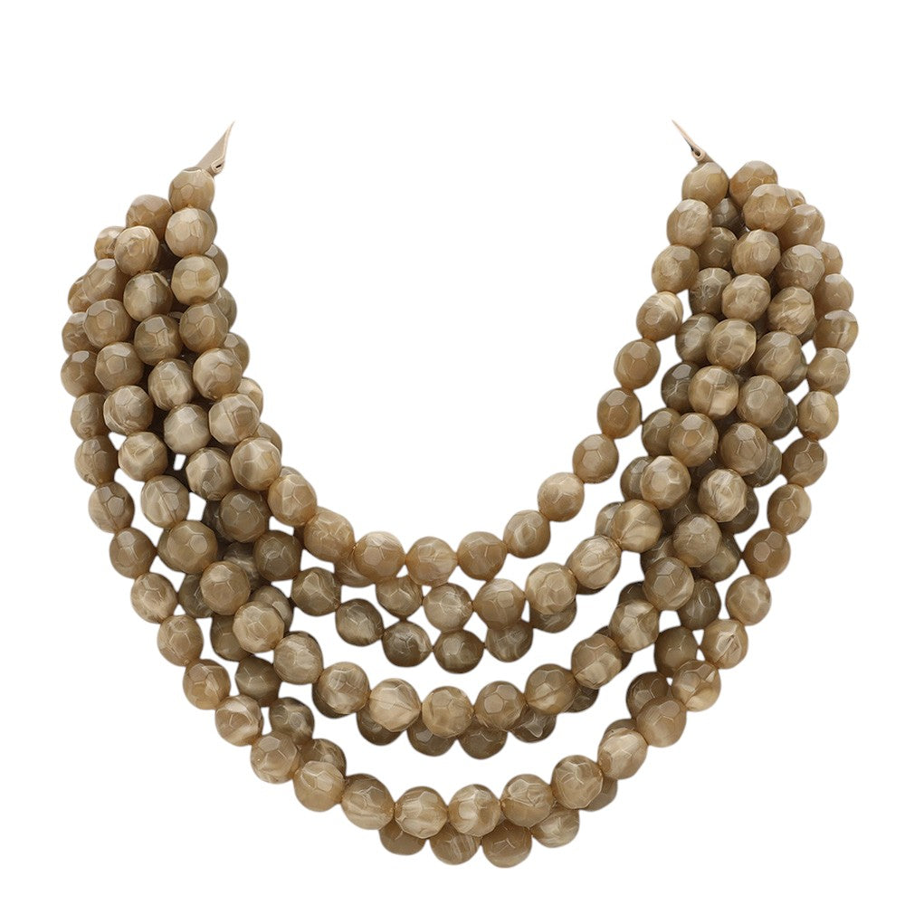 Chunky multi-strand beaded statement necklace shown in an additional colorway on a display form