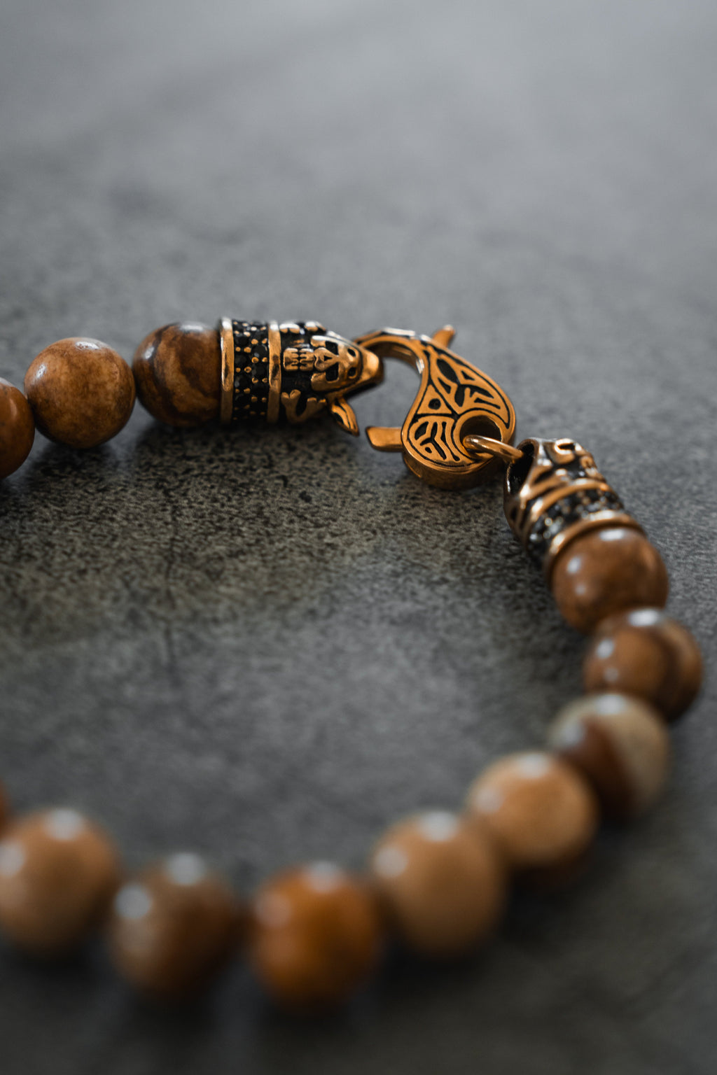 Desert Storm Gemstone GOLD Ed. Bracelet: brown marbled round beads with decorative gold-tone clasp, clasp close-up.