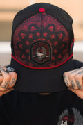 All Gas No Brakes Premium Snapback: black cap with red bandana-style print, skull patch and red rope trim, front view on a model.