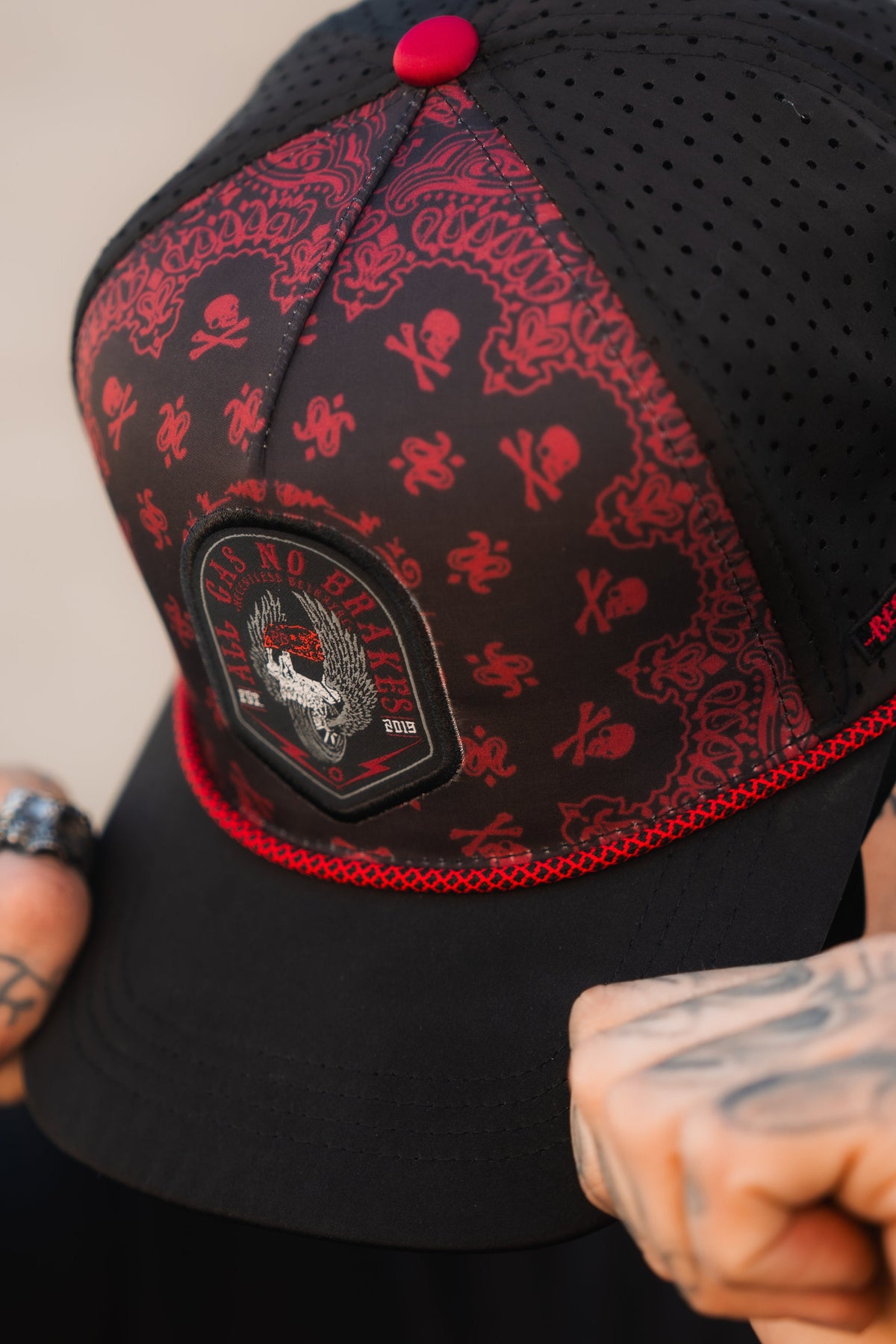All Gas No Brakes Premium Snapback: black cap with red bandana-style print, skull patch and red rope trim, front detail on a model.