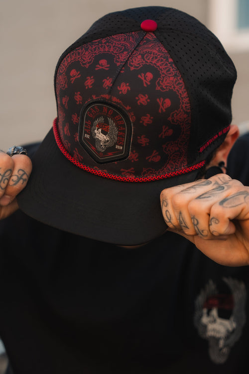 All Gas No Brakes Premium Snapback: black cap with red bandana-style print, skull patch and red rope trim, front view on a model.
