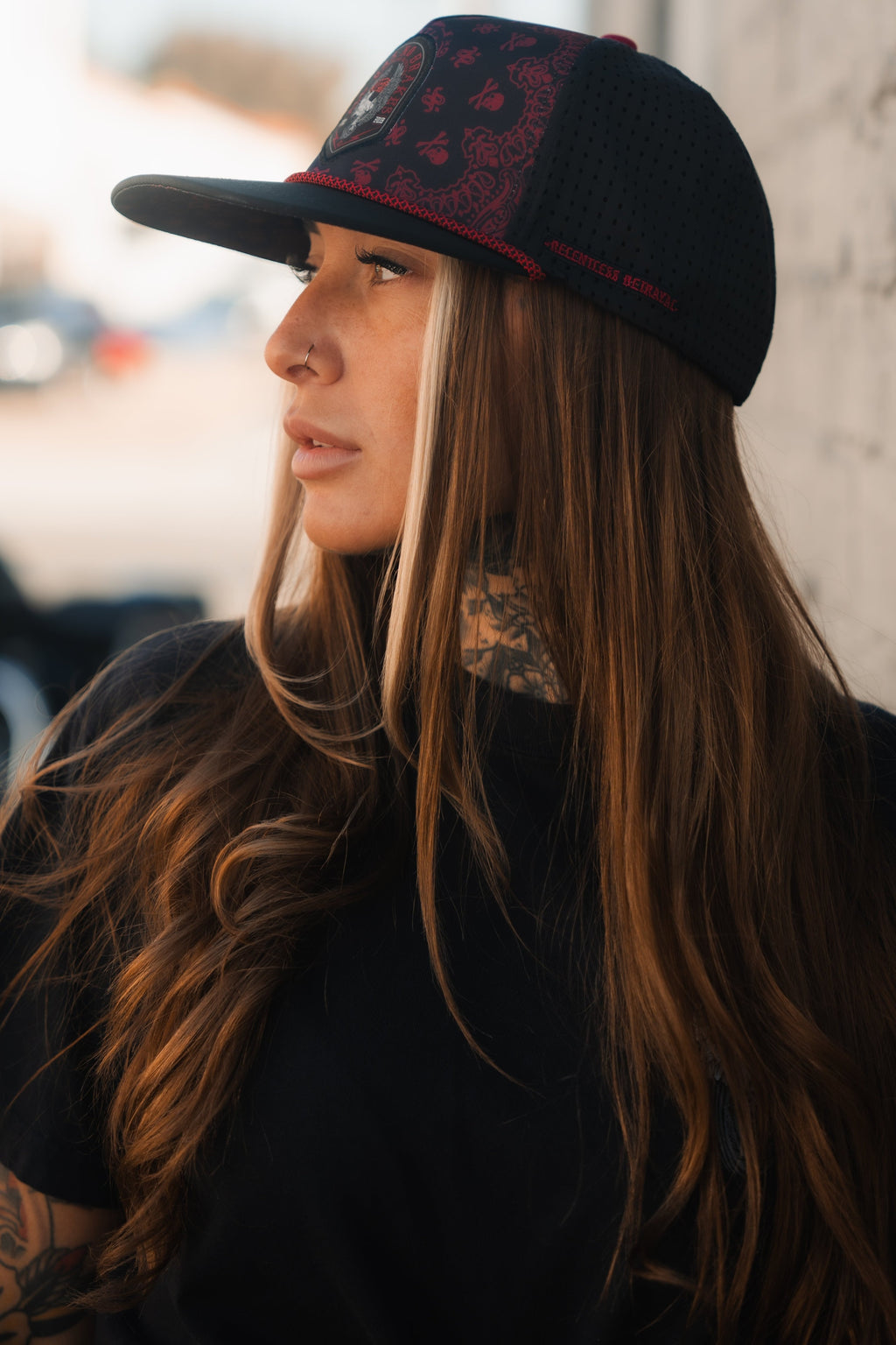 All Gas No Brakes Premium Snapback: black cap with red bandana-style print, skull patch and red rope trim, side view on a model.