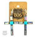 Clear rhinestone cross earring close-up