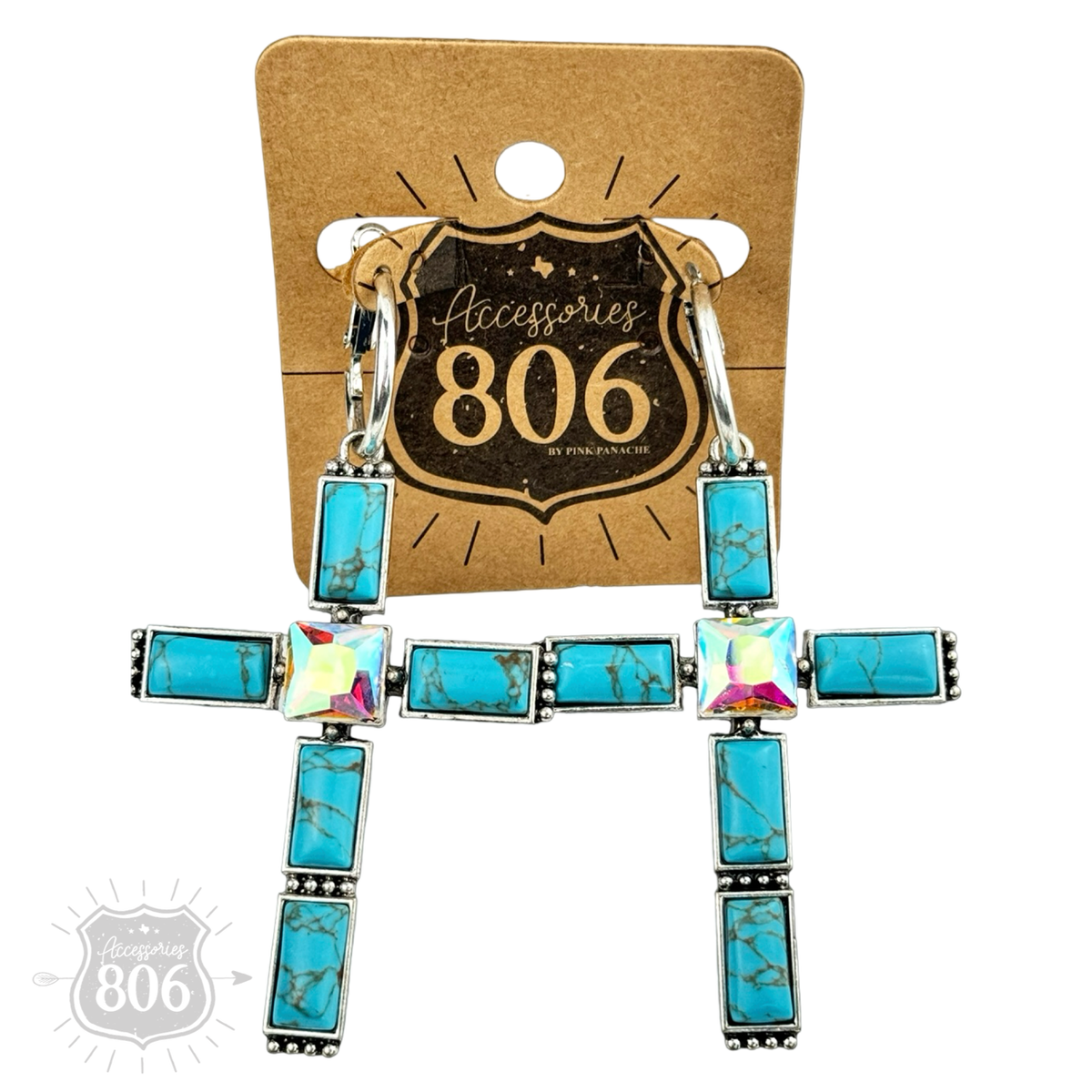 Turquoise-tone cross earring close-up