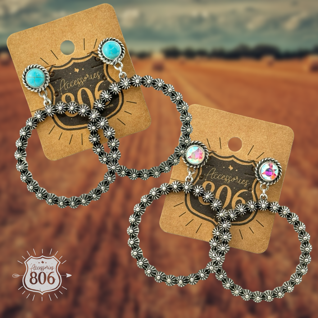 Two colorways of concho berry stud earrings on hang tags: one with a turquoise-color stud, one with an iridescent-cut stud, each above a silver-tone floral-textured bead hoop