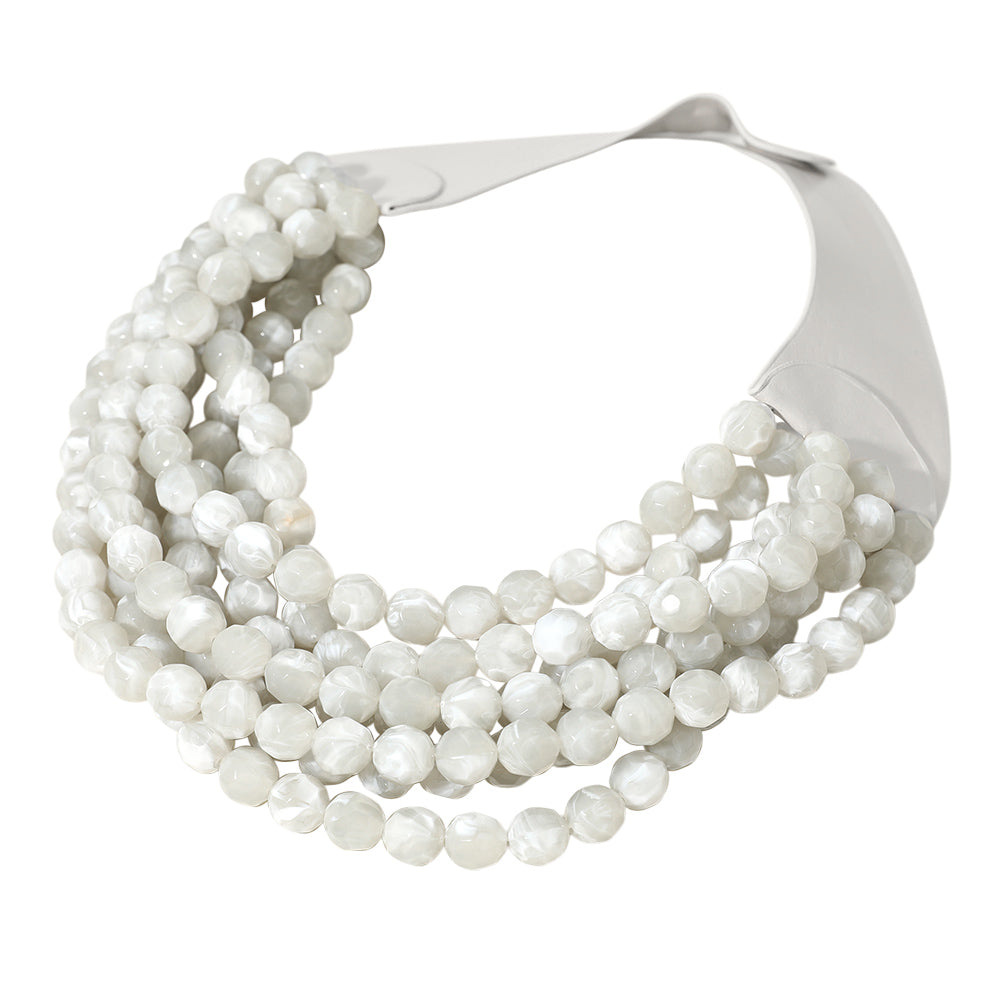 Chunky multi-strand beaded statement necklace shown in an additional colorway on a display form