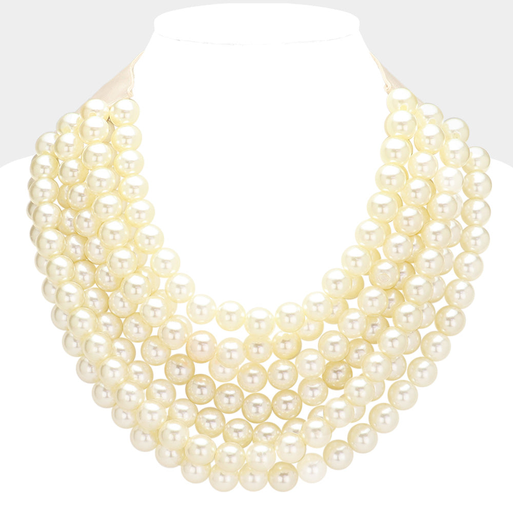 Chunky multi-strand beaded statement necklace shown in an additional colorway on a display form