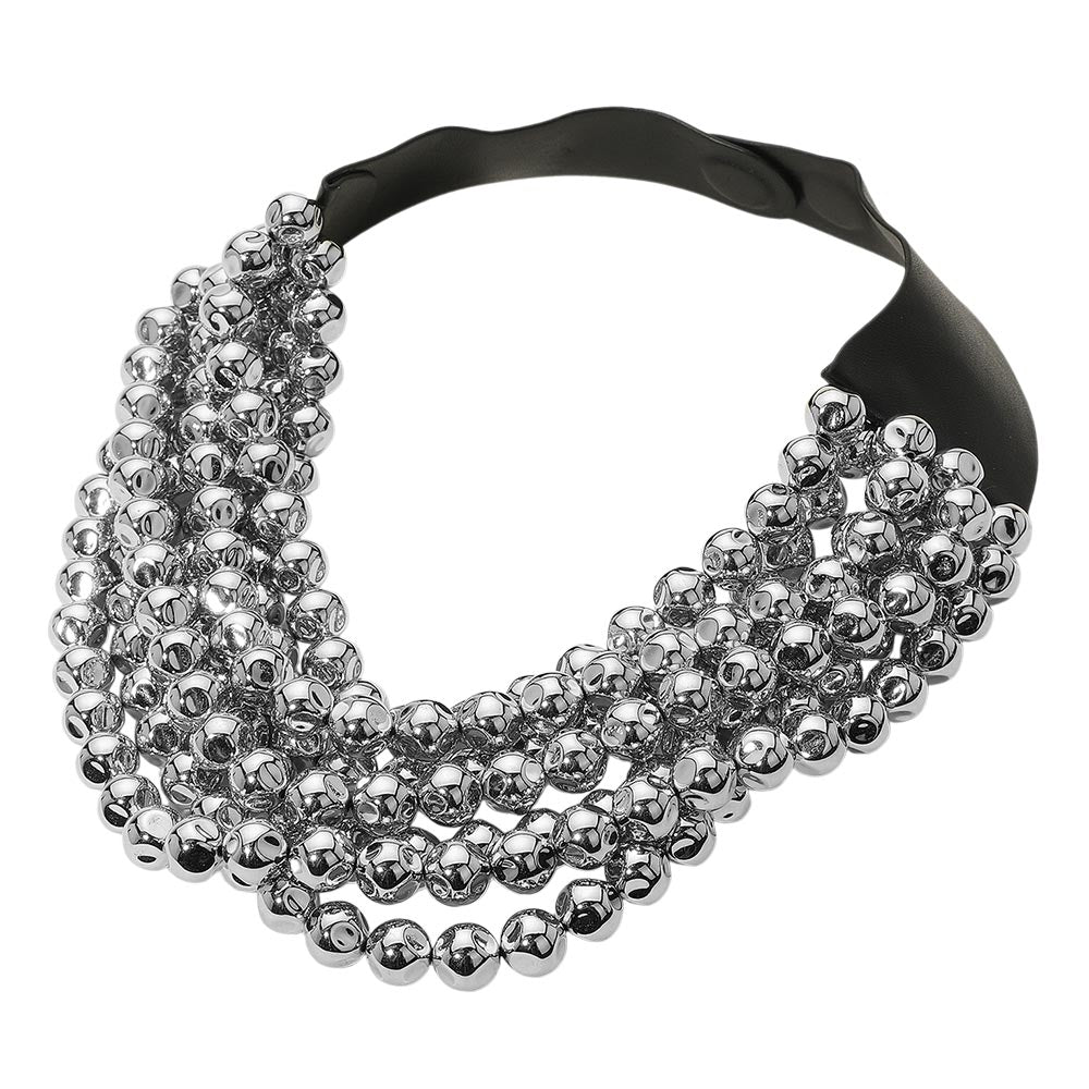 Chunky multi-strand beaded statement necklace shown in an additional colorway on a display form