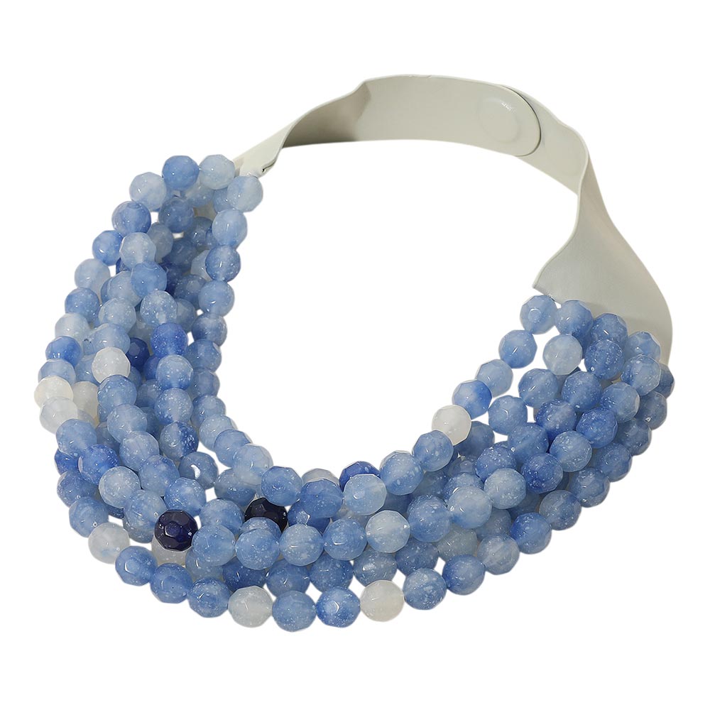 Chunky multi-strand beaded statement necklace shown in an additional colorway on a display form