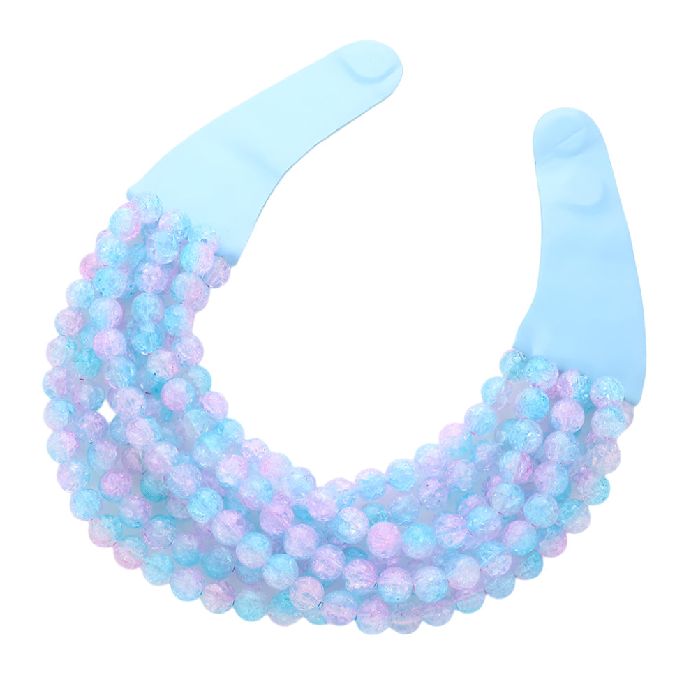 Chunky multi-strand beaded statement necklace shown in an additional colorway on a display form