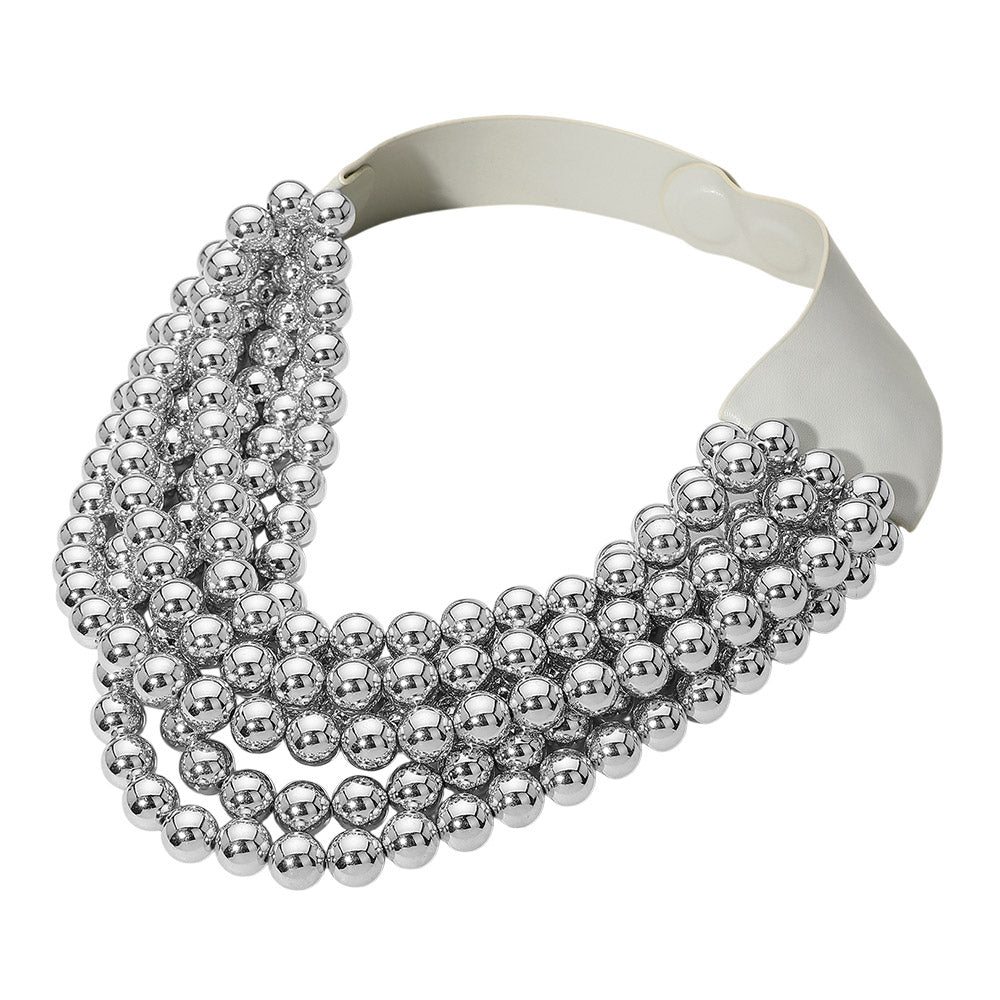 Chunky multi-strand beaded statement necklace shown in an additional colorway on a display form