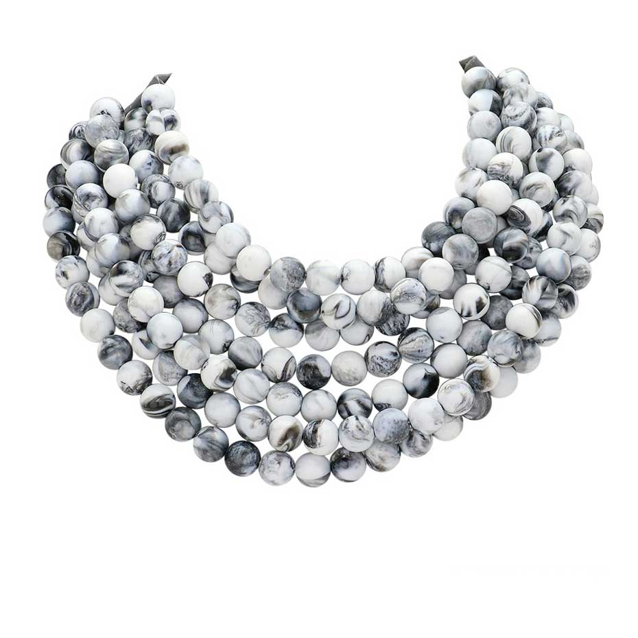 Chunky multi-strand beaded statement necklace shown in an additional colorway on a display form