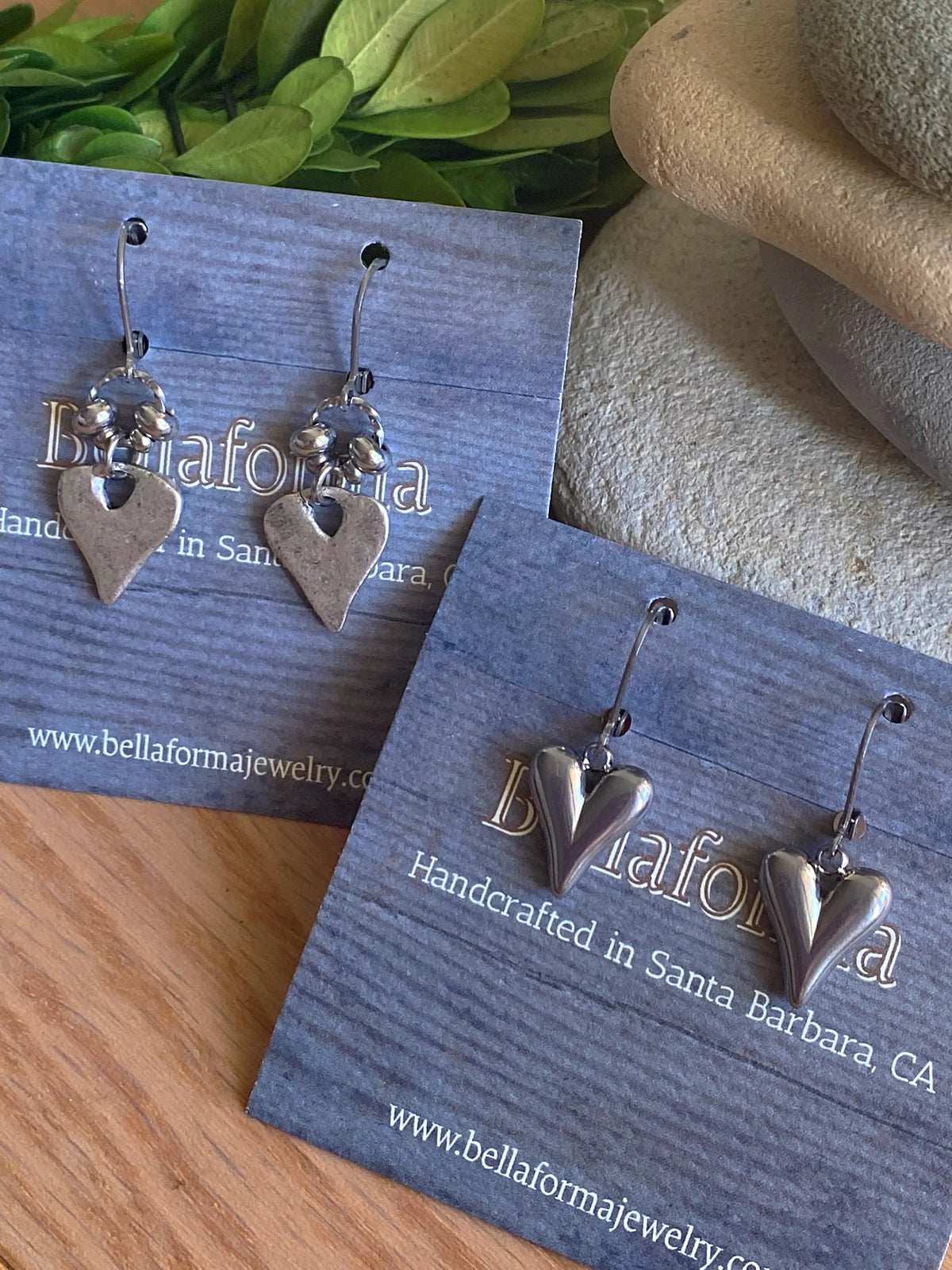 Heart earrings on display cards; additional styles are not included