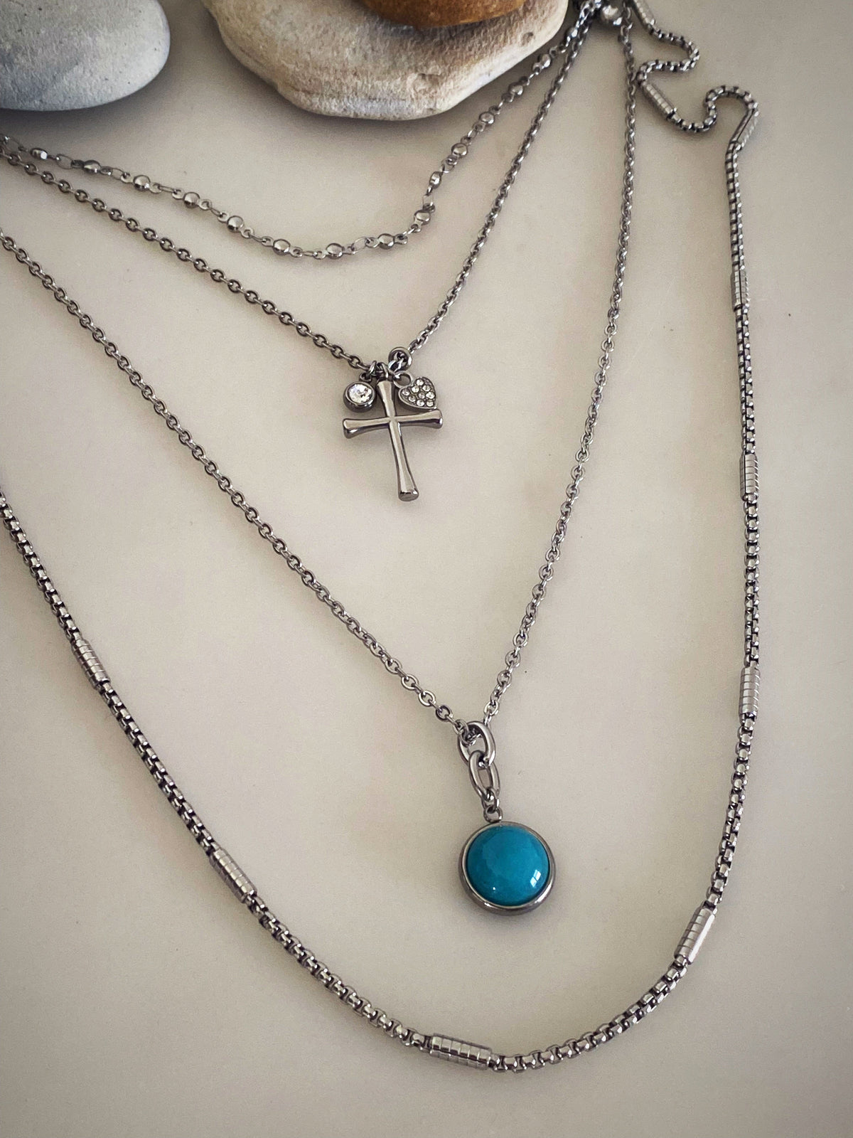 Additional product photo of the Layered Stone Charm Necklace showing the round stone pendant on a fine chain