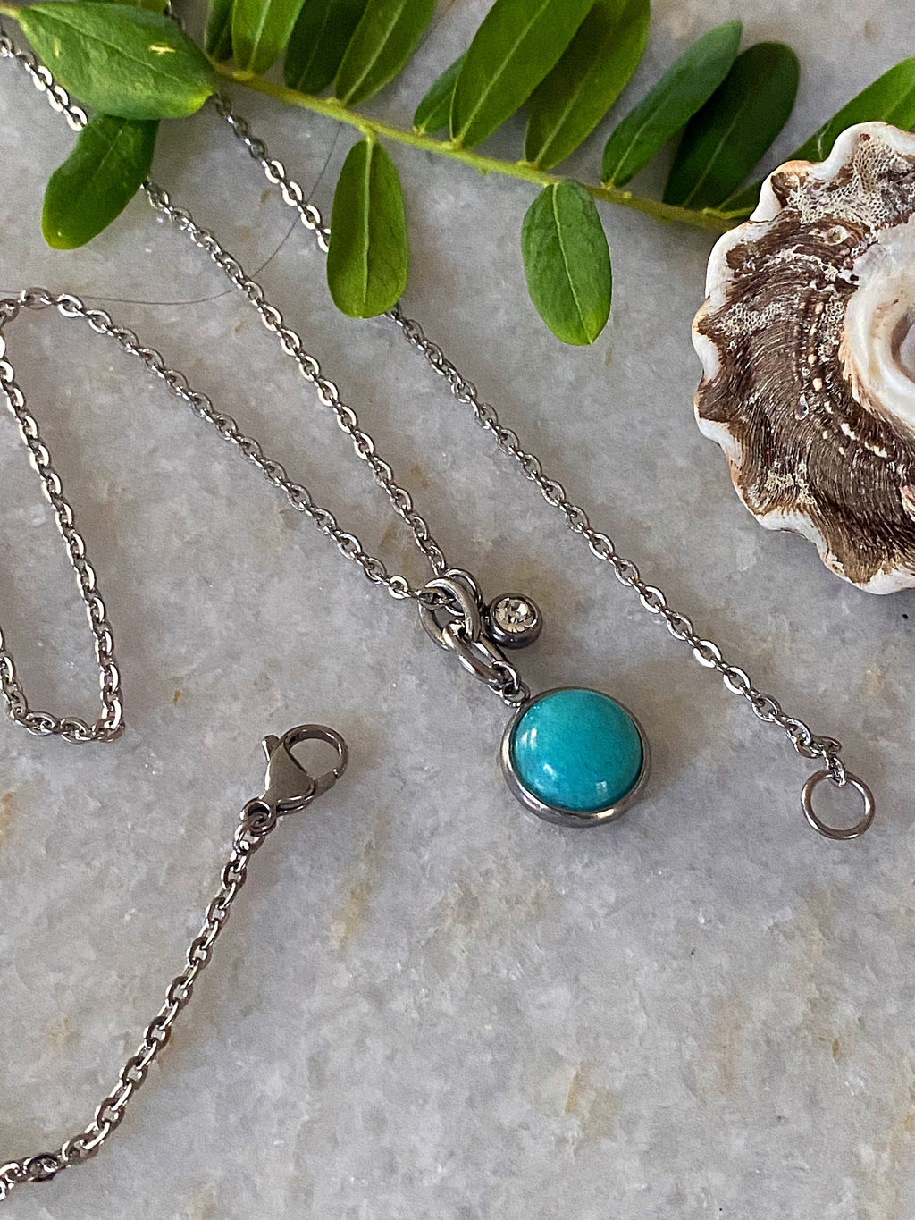 Additional product photo of the Layered Stone Charm Necklace showing the round stone pendant on a fine chain