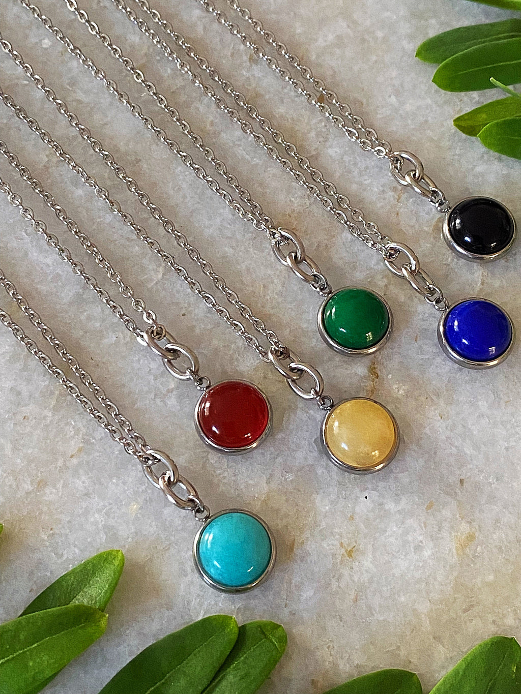Additional product photo of the Layered Stone Charm Necklace showing the round stone pendant on a fine chain