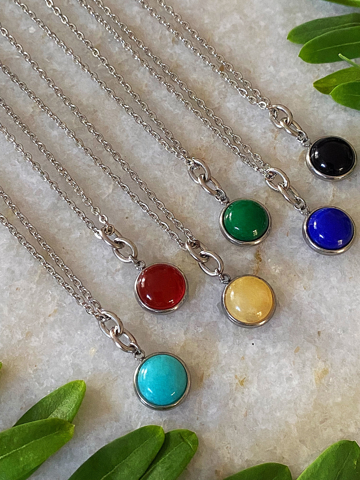 Additional product photo of the Layered Stone Charm Necklace showing the round stone pendant on a fine chain