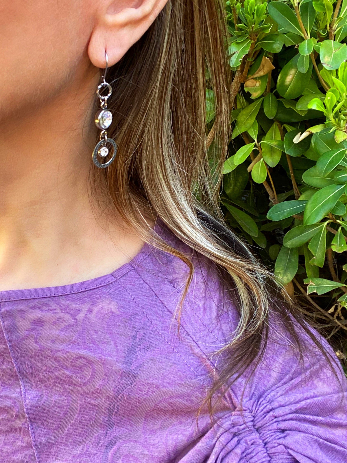 Venus Sunlight Rhinestone Drop Earrings worn with a purple top