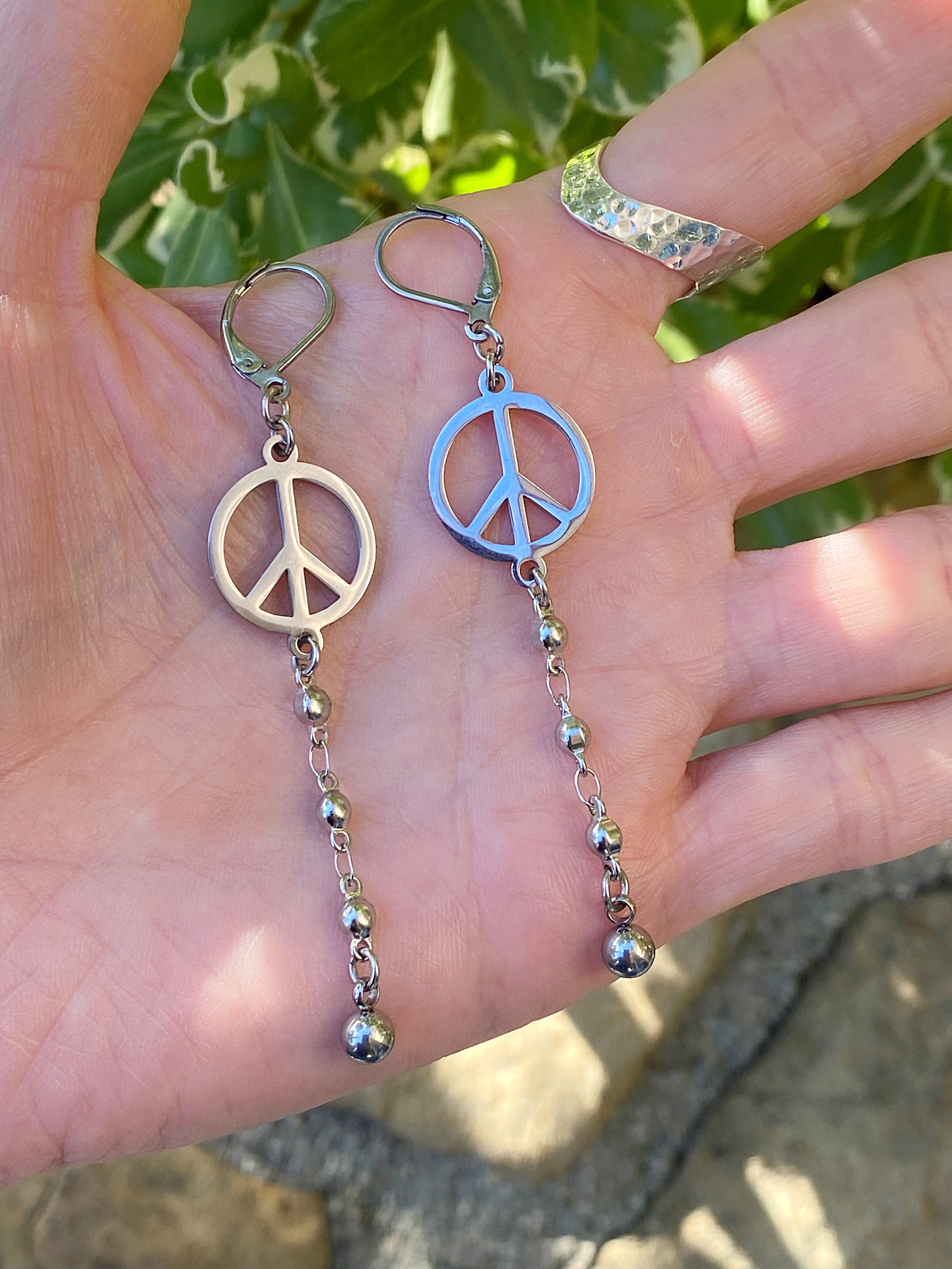 Additional product photo of the Peace Sign Drop Earrings showing the peace sign charm and beaded chain drop