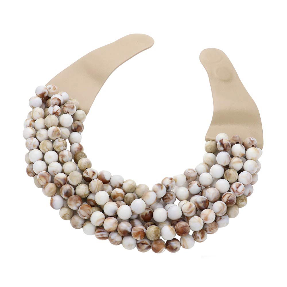 Chunky multi-strand beaded statement necklace shown in an additional colorway on a display form