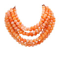 Chunky multi-strand beaded statement necklace shown in an additional colorway on a display form