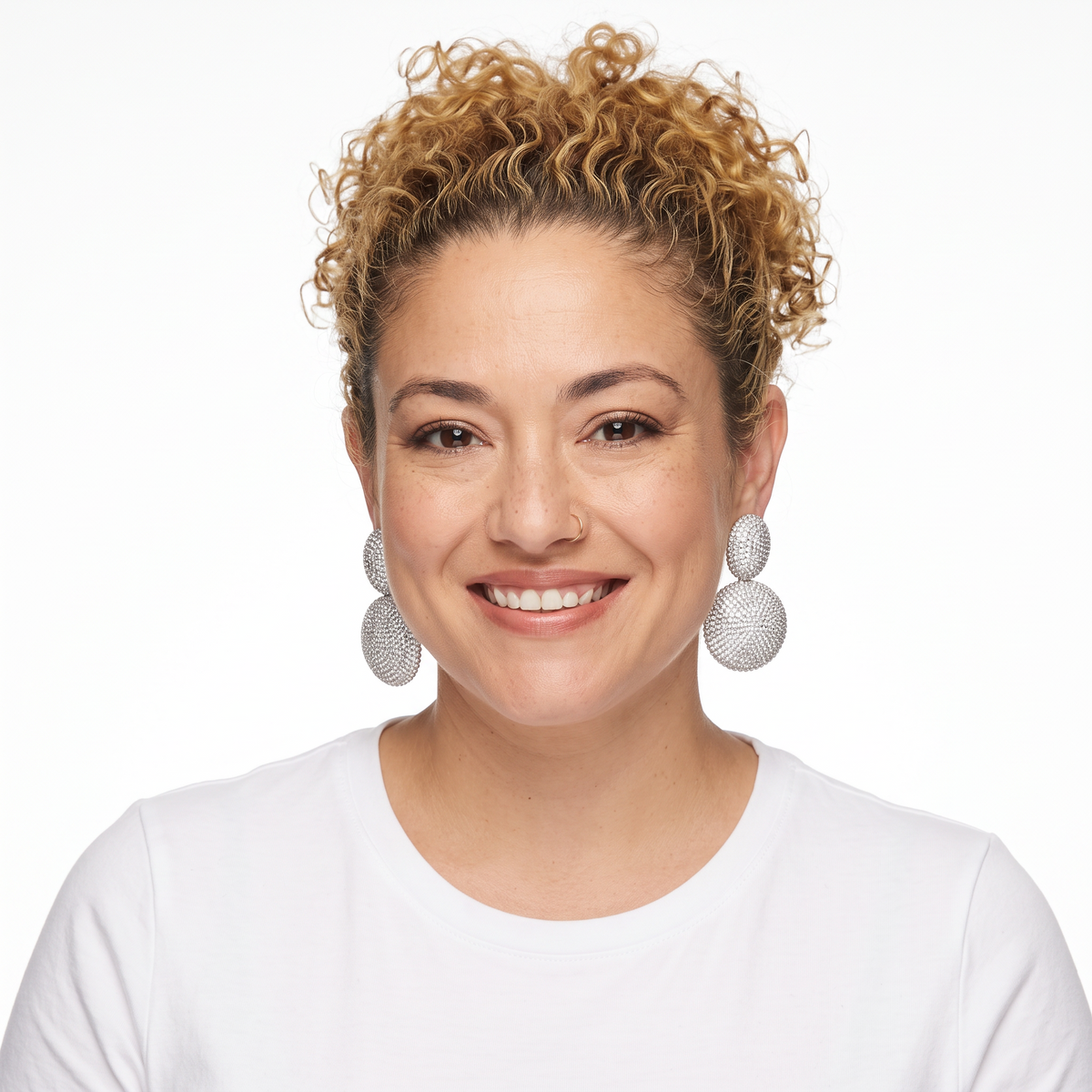 Dopamine Alley double disc statement earrings featuring shimmering pavé rhinestones worn by a smiling woman.