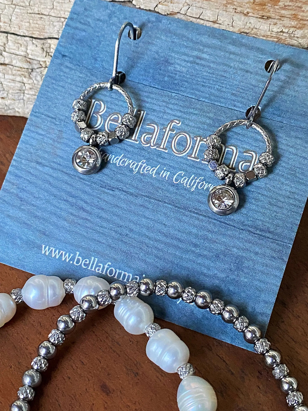 Halo Shimmer Rhinestone Earrings on a blue card; other jewelry shown is not included