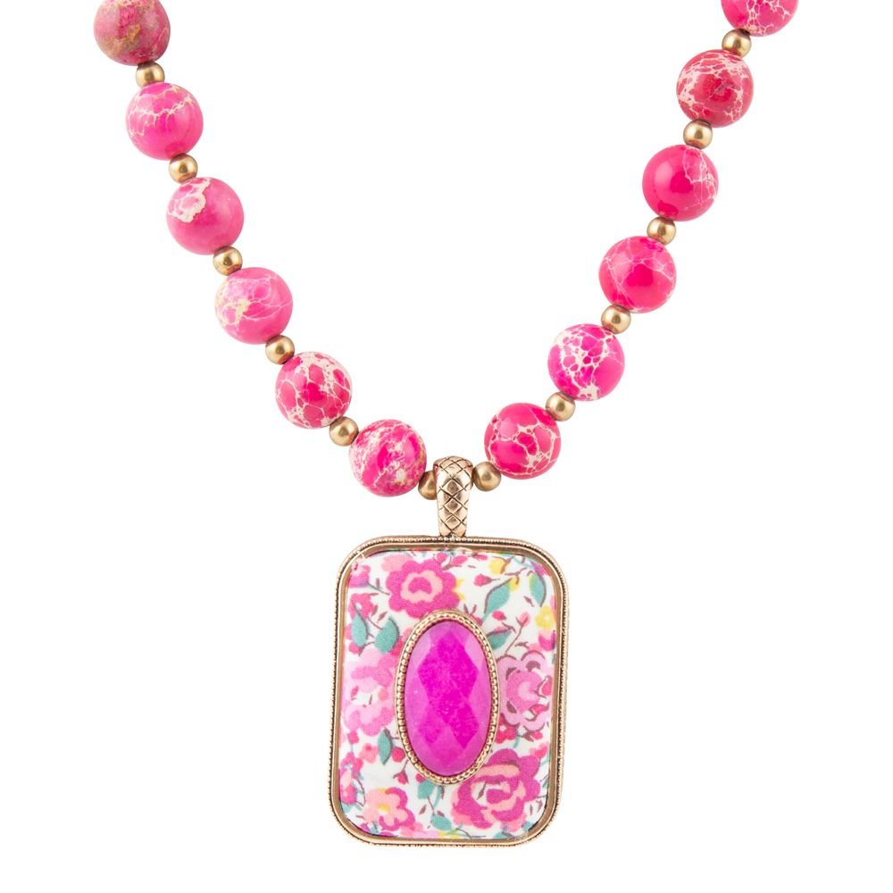 Pink beaded necklace with a rectangular floral-backed pendant and pink center stone.